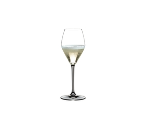 Two RIEDEL Heart to Heart Champagne Glasses. One is unfilled, the other one is filled with Champagne on white background.