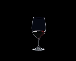 RIEDEL Ouverture Restaurant Magnum filled with a drink on a black background