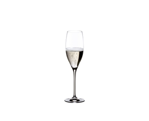 Two RIEDEL Vinum Cuvée Prestige glasses filled with sparkling wine stand side by side on white background