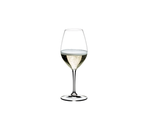 A RIEDEL Wine Friendly White Wine / Champagne Wine Glass filled with white wine on a white background.