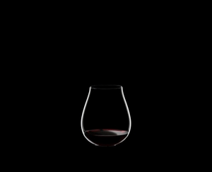 RIEDEL Restaurant O Pinot Noir filled with a drink on a black background