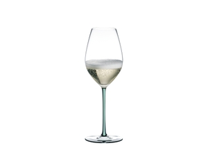 A RIEDEL Fatto A Mano Champagne Glass with a mint colored stem and filled with champagne.