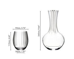 A RIEDEL Optical O Longdrink glass filled with a decorated Gin Tonic and an unfilled RIEDEL Performance Decanter side by side on white background.