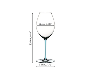 A RIEDEL Fatto A Mano Syrah glass in turquoise filled with red wine on a white background. 