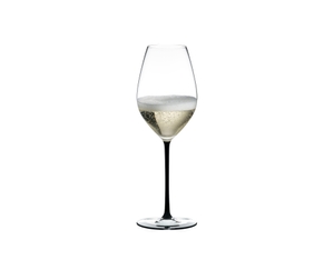 A RIEDEL Fatto A Mano Champagne Wine Glass in black filled with champagne on a transparent background. 