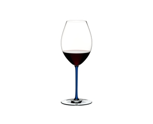 RIEDEL Fatto A Mano Syrah Dark Blue filled with a drink on a white background