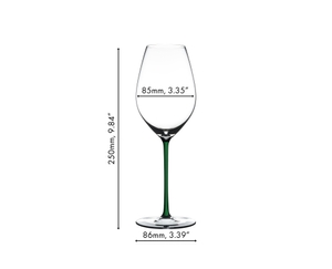 A RIEDEL Fatto A Mano Champagne Wine Glass in green stands together with a bottle of wine, a white, a dark blue, a yellow, a red and a black Fatto A Mano Champagne Wine Glass against a gray background. 