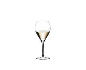 RIEDEL Sommeliers Sauternes filled with a drink on a white background