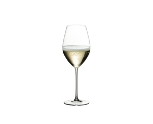 RIEDEL Veritas Restaurant Champagne Wine Glass filled with a drink on a white background