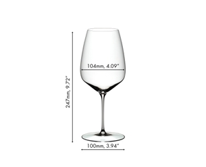 A RIEDEL Veloce Cabernet/Merlot glass filled with red wine on a white background.