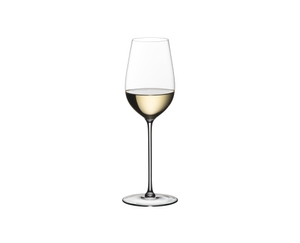 An african american woman wearing a glittery black dress smells white wine from a RIEDEL Superleggero Riesling glass