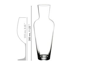 A RIEDEL Wine Friendly Decanter filled with white wine against a white background.