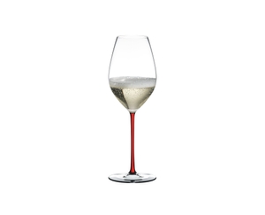 A RIEDEL Fatto A Mano Champagne Wine Glass with red stem filled with red wine.
