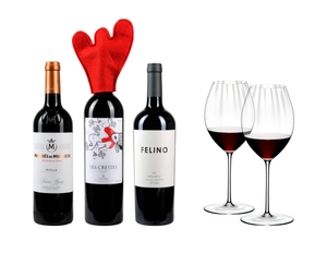 3 different closed bottles of red wine side by side and next to 2 red wine filled RIEDEL Performance Syrah/Shiraz glasses on white background.