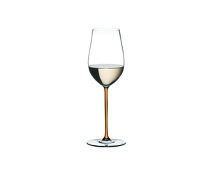 A RIEDEL Fatto A Mano Riesling with an orange stem and filled with white wine.
