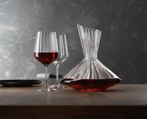 An unfilled Spiegelau Lifestyle Decanter and two unfilled Spiegelau Lifestyle Red Wine Glasses side by side on white background