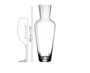 White wine filled RIEDEL Wine Friendly Decanter and a schematic wine glass icon which shows the height of the decanter and the wine glass in relation.