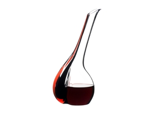 RIEDEL Decanter Black Tie Touch Red R.Q. filled with a drink on a white background