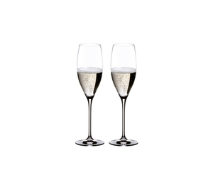 Two RIEDEL Vinum Cuvée Prestige glasses filled with sparkling wine stand side by side