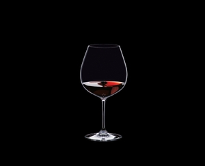 RIEDEL Vinum Restaurant Pinot Noir (Burgundy red) filled with a drink on a black background