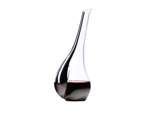 RIEDEL Decanter Black Tie Touch R.Q. filled with a drink on a white background