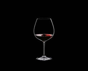 RIEDEL Restaurant Pinot Noir filled with a drink on a black background
