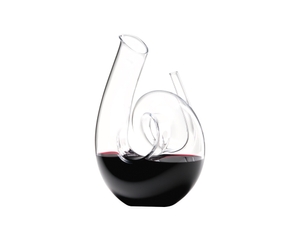 RIEDEL Decanter Curly R.Q. filled with a drink on a white background