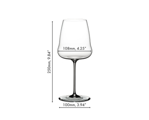 A RIEDEL Winewings Chardonnay glasses filled with white wine on a white background.