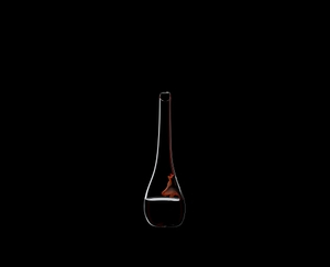 RIEDEL Decanter Dog Black/Red filled with a drink on a black background