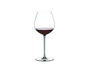 A RIEDEL Fatto A Mano Pinot Noir with a mint colored stem and filled with red wine.