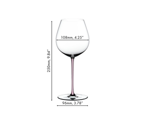 A RIEDEL Fatto A Mano Pinot Noir glass in pink filled with red wine on a white background. 