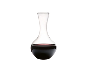 Red wine filled RIEDEL Syrah Decanter on white background