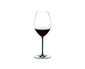 RIEDEL Fatto A Mano Syrah Green filled with a drink on a white background