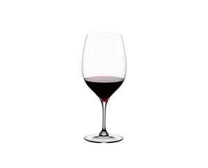 RIEDEL Grape@RIEDEL Cabernet/Merlot filled with a drink on a white background