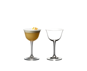 Two RIEDEL Drink Specific Glassware Sour glasses one filled with Whisky Sour and one unfilled on a white background.