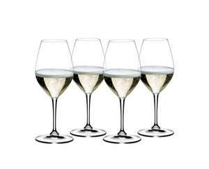 4 RIEDEL Vinum Champagne Wine Glasses filled with champagne stand slightly offset side by side