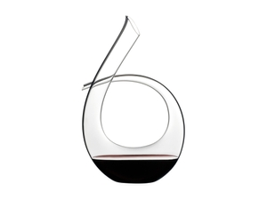 RIEDEL Decanter Black Tie R.Q. filled with a drink on a white background