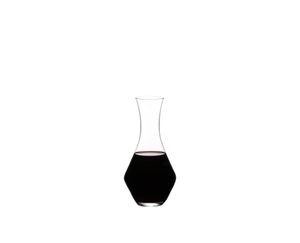 RIEDEL Merlot Decanter filled with a drink on a white background