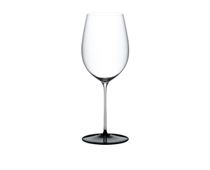 RIEDEL Fatto A Mano Black Tie Bordeaux Grand Cru filled with a drink on a white background