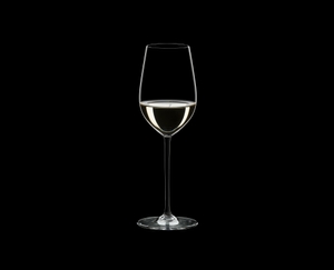 RIEDEL Fatto A Mano Riesling/Zinfandel Black R.Q. filled with a drink on a black background
