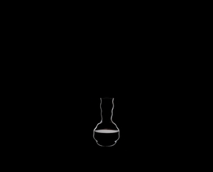 RIEDEL Decanter Swirl R.Q. filled with a drink on a black background