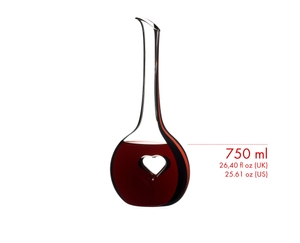 A RIEDEL Black Tie Bliss Decanter with a red stripe filled with red wine.