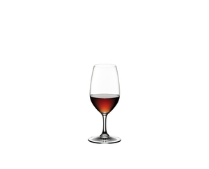 2 RIEDEL Vinum Port glasses side by side on white background. The glass on the left is filled with port wine, the other glass is empty.