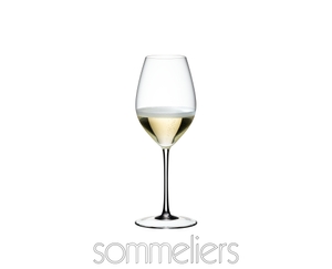 RIEDEL Sommeliers Champagne Wine Glass filled with a drink on a white background