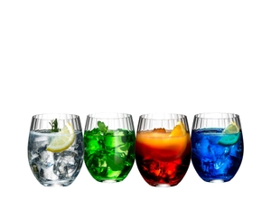 Four tumblers of the RIEDEL Mixing Tonic Set filled with various mixed drinks stand side by side.