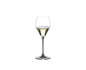 RIEDEL Heart to Heart Champagne Glass filled with a drink on a white background