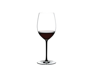 RIEDEL Fatto A Mano Cabernet/Merlot filled with a drink on a white background