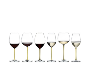An unfilled RIEDEL Fatto A Mano Riesling/Zinfandel glass in yellow on a white background with product dimensions: Height: 250 mm | 9.84 inch Biggest diameter: 79 mm | 3.11 inch Base diameter: 96 mm | 3.78 inch. 