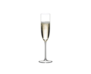 RIEDEL Sommeliers Champagne Flute filled with a drink on a white background