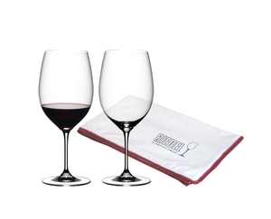 One red wine filled and one unfilled RIEDEL Vinum Cabernet Sauvignon/Merlot (Bordeaux) glass and a RIEDEL Microfiber Polishing Cloth on white background